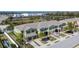 An aerial showcases an amazing community with attached garages and beautiful palm trees at 12973 Dream Catcher Way, Riverview, FL 33579