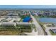 This aerial view captures a building near a pond, showcasing the surrounding neighborhood at 12973 Dream Catcher Way, Riverview, FL 33579