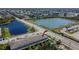 Aerial view of a building with a lake nearby, offering scenic views and recreation at 12973 Dream Catcher Way, Riverview, FL 33579