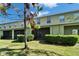 Backyard with mature landscaping, green lawn, and a screened patio at 12973 Dream Catcher Way, Riverview, FL 33579