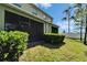 An inviting screened patio is surrounded by lush landscaping and offers outdoor relaxation at 12973 Dream Catcher Way, Riverview, FL 33579