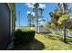 View of the backyard with a white vinyl fence and lush green lawn at 12973 Dream Catcher Way, Riverview, FL 33579