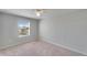 Neutral bedroom featuring plush carpeting, a large window and neighborhood views at 12973 Dream Catcher Way, Riverview, FL 33579