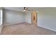 Spacious bedroom featuring neutral walls, plush carpeting, and an en-suite bathroom at 12973 Dream Catcher Way, Riverview, FL 33579