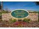 Stone sign with colorful flowers at the community entrance at 12973 Dream Catcher Way, Riverview, FL 33579