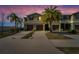Inviting townhome featuring a well-manicured lawn, private garage, and elegant architecture at 12973 Dream Catcher Way, Riverview, FL 33579