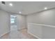 Hallway view featuring neutral walls, plush carpeting and a bedroom with views of the neighborhood at 12973 Dream Catcher Way, Riverview, FL 33579