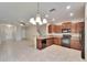 Open-concept kitchen seamlessly blending into the living area, creating a spacious and inviting atmosphere at 12973 Dream Catcher Way, Riverview, FL 33579