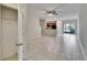 Bright living room featuring tile floors, a ceiling fan, and sliding glass doors at 12973 Dream Catcher Way, Riverview, FL 33579