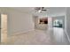 Open concept living area with tile flooring and a view of the kitchen at 12973 Dream Catcher Way, Riverview, FL 33579