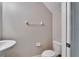 Cozy powder room with neutral paint, toilet, sink and towel bar at 12973 Dream Catcher Way, Riverview, FL 33579