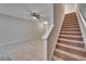Carpeted staircase leading to the upper level of the home at 12973 Dream Catcher Way, Riverview, FL 33579