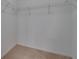 A carpeted, walk-in closet with ample storage, and wire shelving at 12973 Dream Catcher Way, Riverview, FL 33579