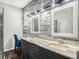 Bathroom features a double vanity, granite countertops, and decorative mirrors at 13192 Royal Pines Ave, Riverview, FL 33579