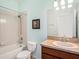 A cozy bathroom showcasing a vanity, toilet, shower and bathtub, framed artwork, and a neutral color scheme at 13192 Royal Pines Ave, Riverview, FL 33579