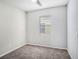 Bedroom features a single window, neutral walls, and carpeted floor at 13192 Royal Pines Ave, Riverview, FL 33579