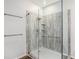 Modern bathroom showcasing a glass-enclosed shower with sleek fixtures and shelving at 13192 Royal Pines Ave, Riverview, FL 33579