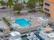Aerial view of the community pool and hot tub with gulf views at 13235 Gulf Blvd # 306, Madeira Beach, FL 33708