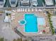 Overhead shot of the community pool and hot tub with gulf views at 13235 Gulf Blvd # 306, Madeira Beach, FL 33708