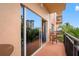 Balcony view features outdoor seating and views of a building; showcases indoor and outdoor flow at 13235 Gulf Blvd # 306, Madeira Beach, FL 33708