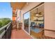 Balcony showcasing outdoor seating and views into the living area, blending indoor-outdoor living at 13235 Gulf Blvd # 306, Madeira Beach, FL 33708