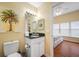 Bathroom featuring marble vanity and a view of the Main Bedroom at 13235 Gulf Blvd # 306, Madeira Beach, FL 33708