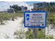 Beach access sign for City of Madeira Beach at 131st Ave, promoting coastal preservation at 13235 Gulf Blvd # 306, Madeira Beach, FL 33708