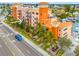 Exterior view of Madeira Bay Resort condo featuring tropical landscaping and boat docks at 13235 Gulf Blvd # 306, Madeira Beach, FL 33708
