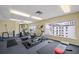 Well-equipped fitness center with machines and views overlooking the gulf at 13235 Gulf Blvd # 306, Madeira Beach, FL 33708