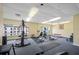 Gym featuring various exercise machines, weights, and large windows, promoting a healthy lifestyle at 13235 Gulf Blvd # 306, Madeira Beach, FL 33708