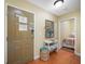 Hallway features decor, access to a bedroom, and a front door with an evacuation route posted at 13235 Gulf Blvd # 306, Madeira Beach, FL 33708