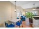 Inviting living space featuring a dining table, a seating area, and balcony access at 13235 Gulf Blvd # 306, Madeira Beach, FL 33708