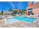 Community pool featuring a jacuzzi and ample seating for residents and guests at 13235 Gulf Blvd # 306, Madeira Beach, FL 33708