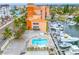 Relaxing condo pool with sun loungers and marina view in a beautiful setting at 13235 Gulf Blvd # 306, Madeira Beach, FL 33708
