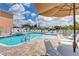 Pool and jacuzzi with ample seating for residents and guests at 13235 Gulf Blvd # 306, Madeira Beach, FL 33708