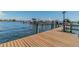 Wooden dock with direct access to the water and boat slips at 1446 Jumana Loop, Apollo Beach, FL 33572