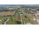 Aerial view of a neighborhood showcasing the home's location with farmland views and proximity to community amenities at 14739 Vista View Ct, Dade City, FL 33523