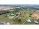 Aerial view of a neighborhood showcasing the home's location with large lots surrounded by forests and greenery at 14739 Vista View Ct, Dade City, FL 33523