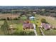 Aerial view of a neighborhood showcasing the home's location with farmland views and proximity to community amenities at 14739 Vista View Ct, Dade City, FL 33523