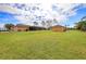 Spacious backyard with a shed and pool area, providing a private oasis for outdoor enjoyment at 14739 Vista View Ct, Dade City, FL 33523
