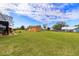 Expansive backyard featuring a shed and a screened patio, perfect for outdoor activities and relaxation at 14739 Vista View Ct, Dade City, FL 33523