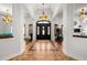 Elegant foyer featuring tile flooring, decorative lighting, and a view into other living spaces at 14739 Vista View Ct, Dade City, FL 33523