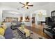 Spacious living room featuring hardwood floors with an open concept layout at 14739 Vista View Ct, Dade City, FL 33523