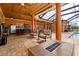 Expansive covered patio featuring a bar, outdoor seating, a fire pit, and an outdoor kitchen for entertaining at 14739 Vista View Ct, Dade City, FL 33523