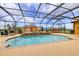 Stunning screened pool and spa with a waterfall feature, perfect for outdoor entertaining at 14739 Vista View Ct, Dade City, FL 33523