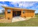 Well-maintained shed with a roll-up door, offering ample storage space and convenience at 14739 Vista View Ct, Dade City, FL 33523