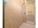 Walk-in shower featuring neutral tiling, glass door, and modern fixtures for a spa-like experience at 14739 Vista View Ct, Dade City, FL 33523