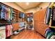 Spacious walk-in closet featuring custom wood shelving, drawers, and ample hanging space for organized storage at 14739 Vista View Ct, Dade City, FL 33523