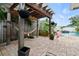 Backyard featuring a pergola with a hammock near a pool at 1560 Bel Keene Dr, Clearwater, FL 33756