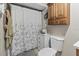 Functional bathroom showcases a shower with curtain and built-in storage at 1560 Bel Keene Dr, Clearwater, FL 33756